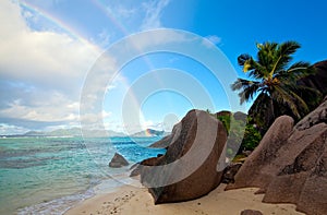 Morning beach with double rainbow