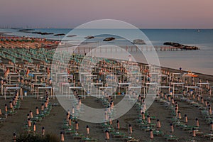 The morning on the beach of Torre Pedrera at Rimini in Italy photo