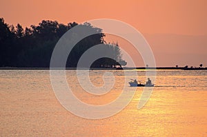 In the morning , Beautiful golden sea and fishing boat of Koh Mak in Trat , Thailand