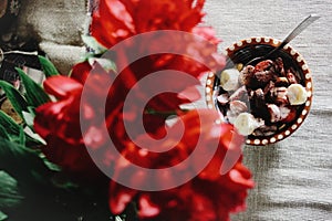 Morning breakfast bananas yogurt cereals in bowl, top view at re