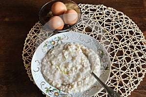 Morning breakfast kitchen fresh natural food oatmeal and boiled egg