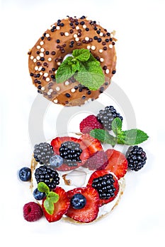 Morning breakfast with mini donuts and berries on plate under po photo