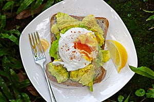 Morning Breakfast Poached Egg with Avocado on Toast