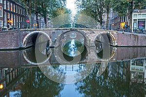 Morning Bridges on the Canal of Amsterdam and Reflection