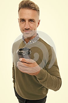 Morning cappuccino. Man prefer coffee take away. Mature man hold paper coffee cup stand white background. Guy casual