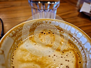 Morning Capucino cup closeup photo