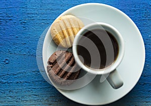 Morning coffee with brown and white cookies