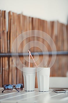 Morning coffee at a table in summer cafe