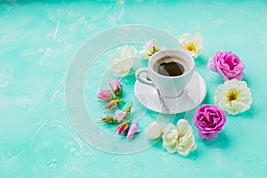 Morning Cup of coffee and a beautiful roses flowers on light background, top view. Cozy Breakfast. Flat lay style.Flat