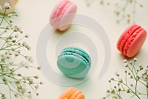 Morning cup of coffee, cake macaron, gift or present box and flo