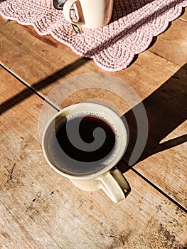 Morning Cup of Coffee on an Old Wooden Table