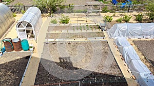 Morning at the dacha. Vegetable beds and greenhouses taken from above