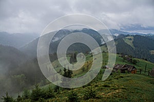 Morning dew fog sun rays in mountains photo