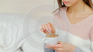 Morning energy hot beverage girl stirring coffee