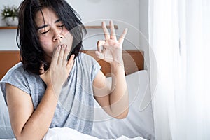morning fatigue, waking up tired Asian woman doesn't feel refreshed after sleeping
