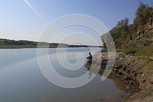 morning fisher by the river in nature