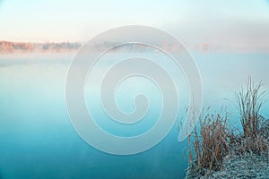 Morning fog on the lake in the frosty morning