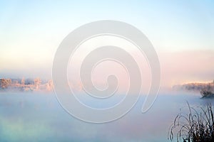 Morning fog on the lake in the frosty morning