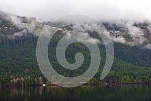 Morning fog in the mountains at Sproat lake in Vancouver Island