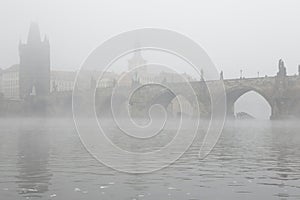 Morning fog over the Charles Bridge in Prague.