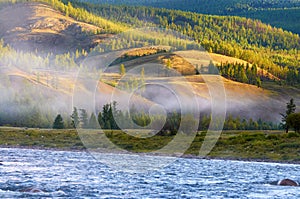 Morning fog on river in northern Mongolia