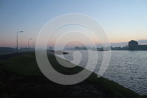 Morning fog during sunrise at river Hollandse IJssel in Moordrecht