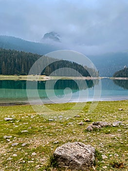 Morning Foggy Sunrise over Black Lake in Durmitor