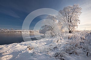 Morning Frosty Winter Landscape With Dazzling White Snow And Hoarfrost, River And A Saturated Blue Sky.Winter Small River On A Sun