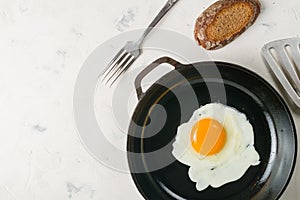 Morning in the kitchen. Cooking breakfast. Fried egg.