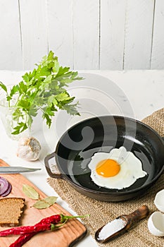 Morning in the kitchen. Cooking breakfast. Fried egg.