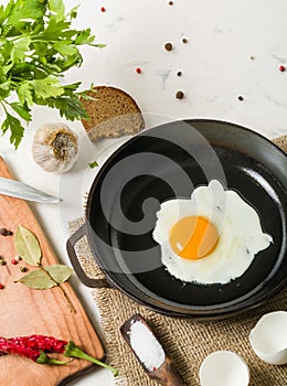 Morning in the kitchen. Cooking breakfast. Fried egg.