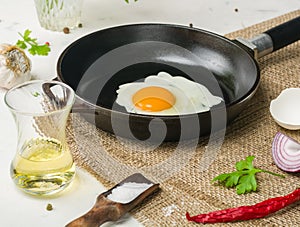 Morning in the kitchen. Cooking breakfast. Fried egg.