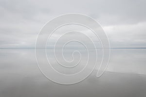 Morning on the lake, the clouds are reflected in the water. Salt Lake Elton, Russia, Volgograd Region.