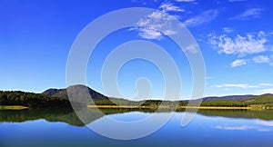 Morning landscape with clear mountain reflection in lake - Dalat, Vietnam