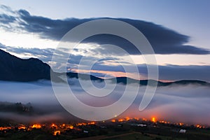 Morning landscape with fog over Coltesti Village in Apuseni MountainsTrascau