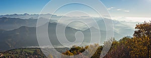 Morning landscape on hills and mountains with humidity in the air and pollution. Panorama from Linzone Mountain