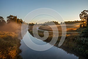 Morning landscape with river and field