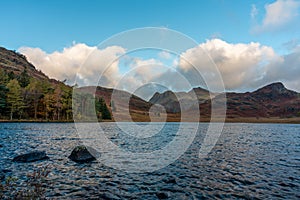 Morning light at Blea Tarn in the English Lake District with views of the Langdale Pikes, and Side Pike during autumn