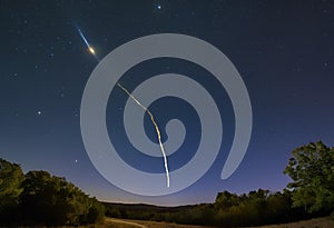 Comet with glowing trail shines brightly in ring.AI Generated