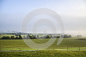 Morning light and ground fog over the grassland at late September in Bavaria, southern Germany