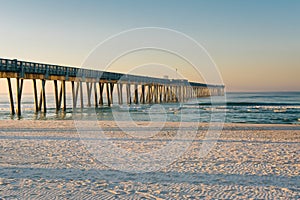 Morning light on the M.B. Miller County Pier and sandy beach along the Gulf of Mexico, in Panama City Beach, Florida