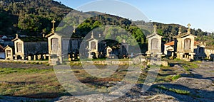 Morning light over granaries and stone storage sheds in the village of Lindoso in Portugal