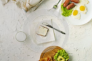 Morning meal concept, table with milk with eggs and nutritious sandwichs