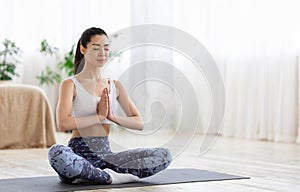Morning Meditation. Sporty Korean Girl Practicing Yoga Exercises At Home