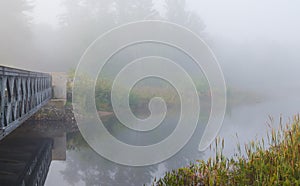 Morning mist at Bridge over Corry lake.