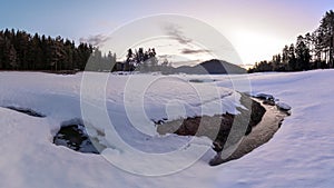 Morning in the mountain. Bottom of the frozen lake Shiroka poliana covered with snow in Rhodope mountain, Bulgaria.