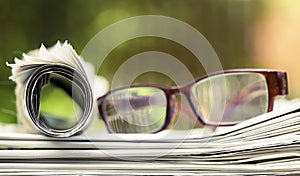 Daily news, reading concept, newspaper with with eyeglasses