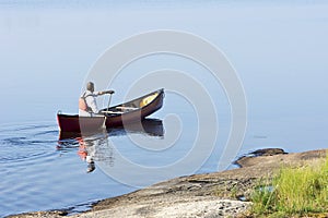 Morning Paddle in a Red Canoe