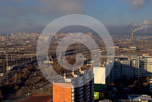 Morning panorama of the city overlooking the railroad tracks and the overpass under construction.