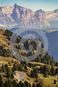 Morning panorama of Gardena mountain pass or Passo Gardena. Looking north towards the road and valley in a sunny weather